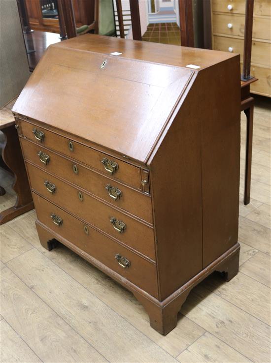 A George III oak bureau, W.91cm